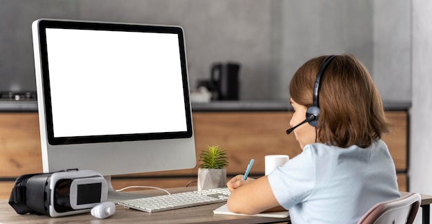 Girl with headset learning online