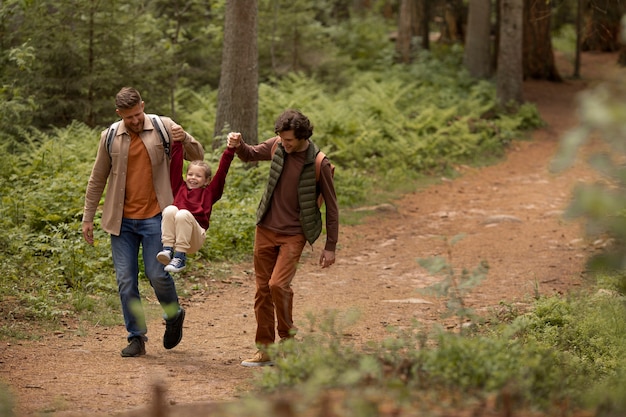 Girl with her dads enjoying family trip