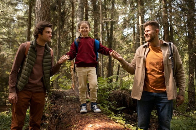 Girl with her dads enjoying family trip