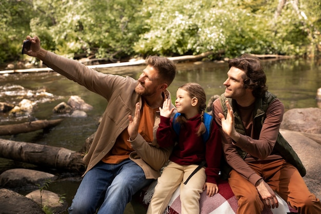 Girl with her dads enjoying family trip