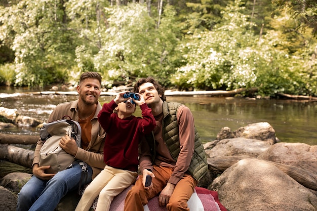 Girl with her dads enjoying family trip