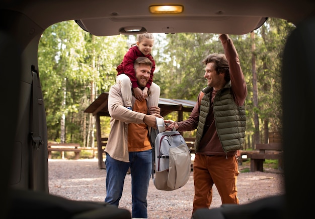 Girl with her dads enjoying family trip