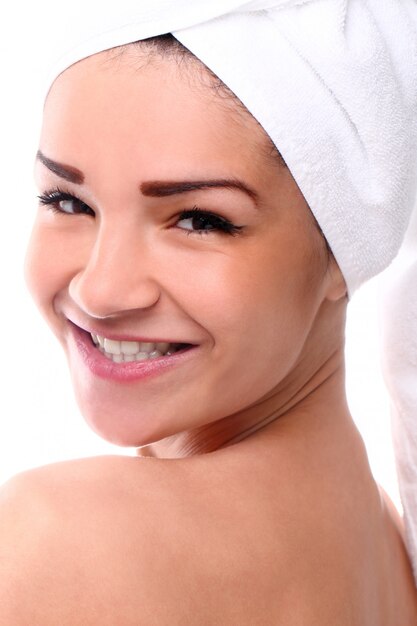 Girl with her head in towel smiling