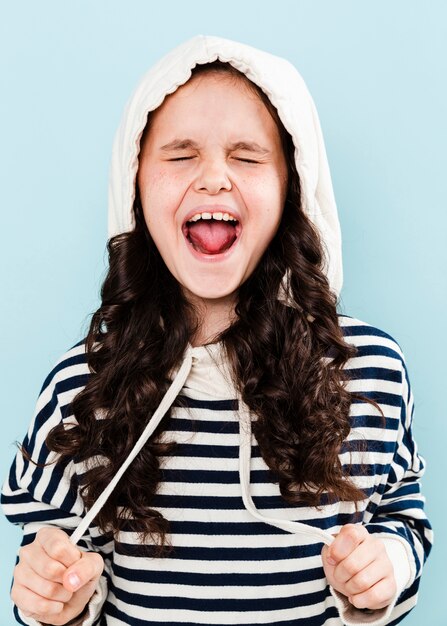 Girl with hoodie making funny faces