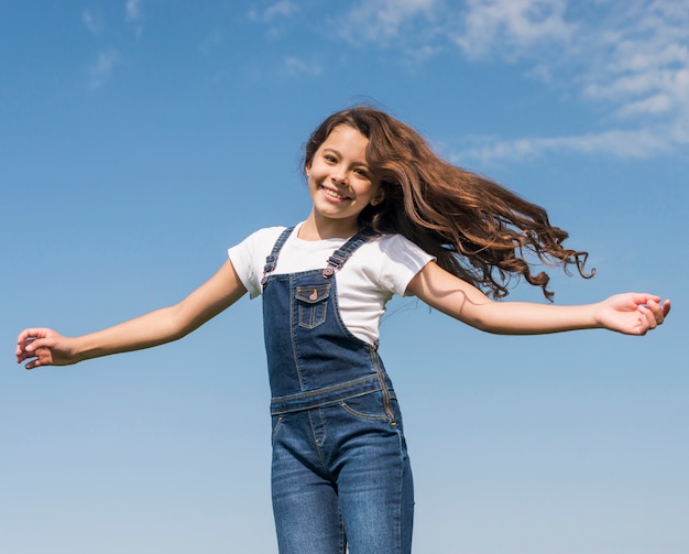 Free photo girl with long hair smiling