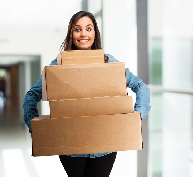 Girl with a lot of boxes