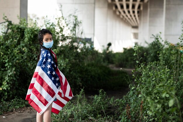 Girl with mask and american flag