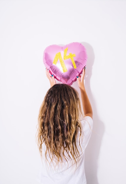 Free photo girl with metallic balloon