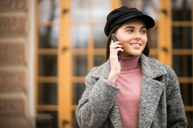 Free photo girl with phone in a street