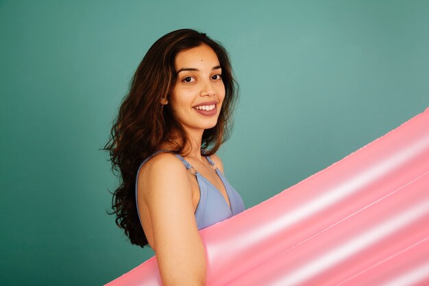 Free photo girl with pool mattress close up view