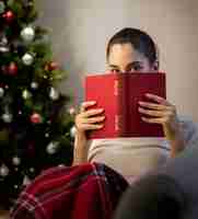 Free photo girl with a red book in her hands