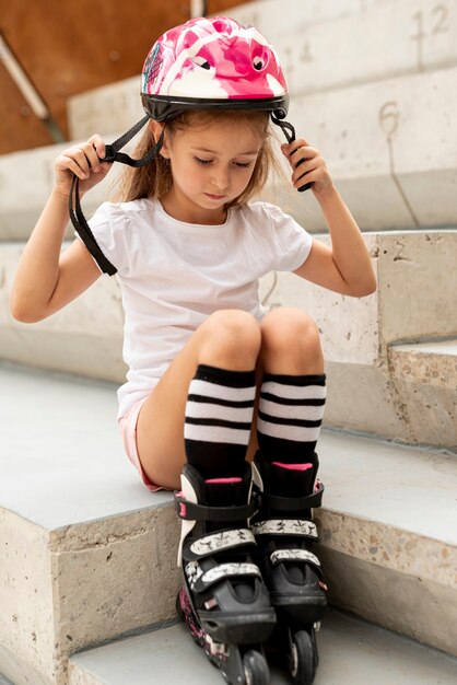 Girl with roller blades and helmet