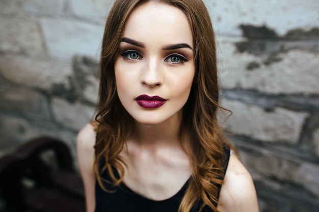 Girl with straight hair and lips painted red