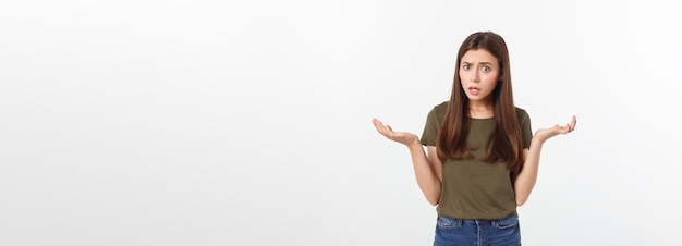 Girl with a suspicious look and hand on her side on a white isolated background