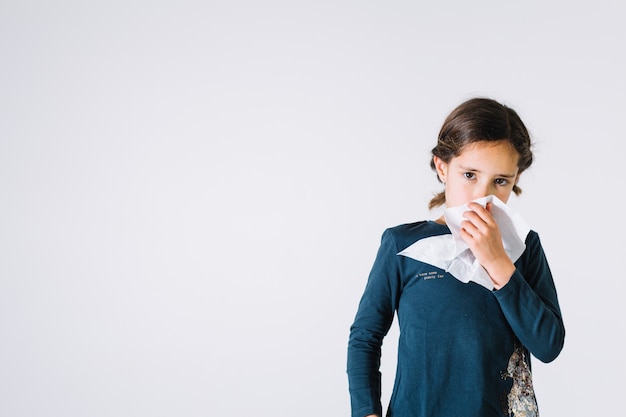 Girl with tissue looking at camera