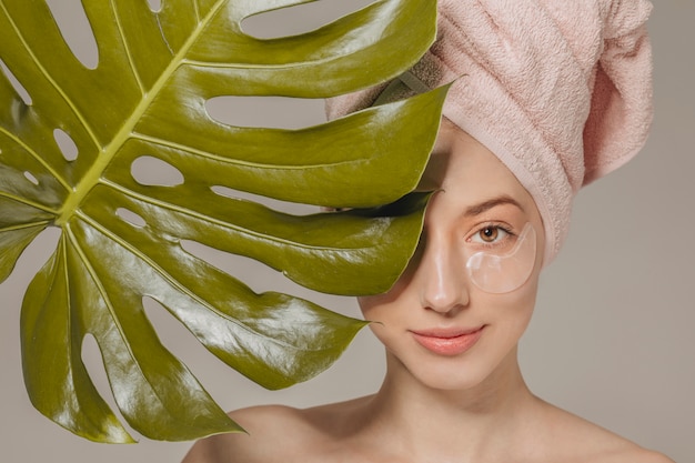 Girl with towel on the head with leaf