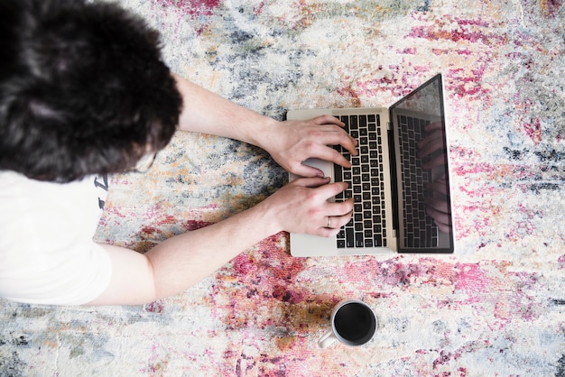 Free photo girl working on grey laptop