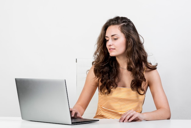 Free photo girl working with her laptop