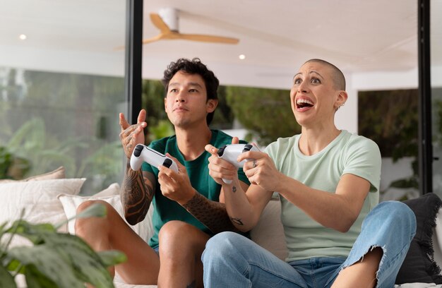 girlfriend and boyfriend playing video games together at home