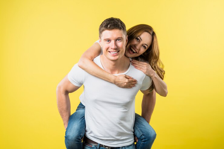 Free Photo girlfriend enjoying the piggyback ride on her boyfriend's back