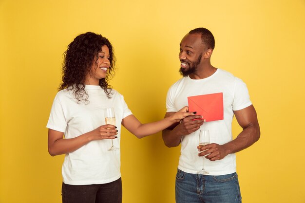 Girlfriend giving red envelope to his boyfriend