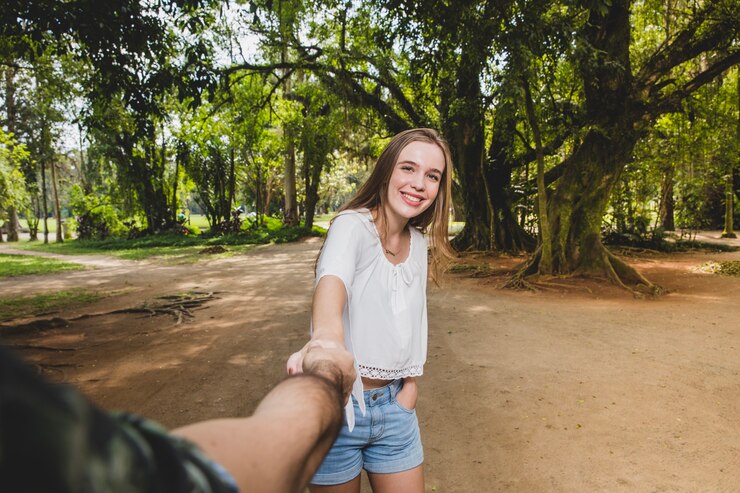 Free Photo girlfriend pulling boyfriend