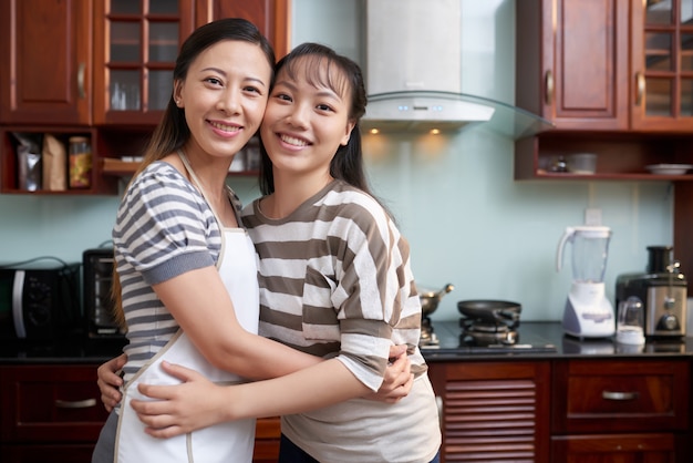 Girlfriends Posing In Kitchen