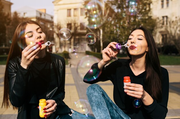 Girls blowing bubbles