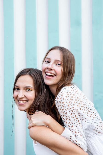 Free photo girls doing piggy back ride