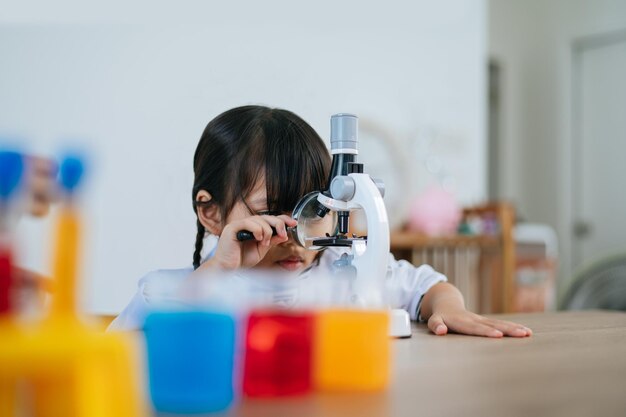 Girls doing science experiments in the lab. Selective focus.