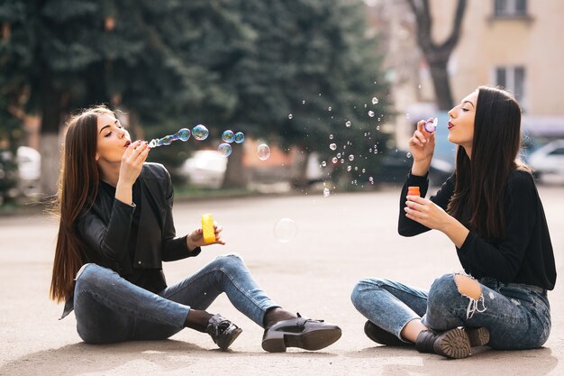 Girls front blowing bubbles