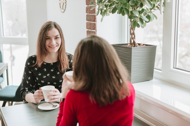 Girls having coffee in a restaurant