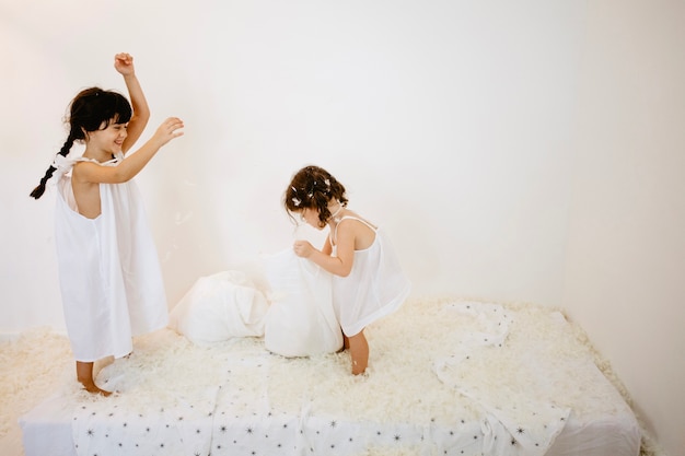 Girls having fun on mattress