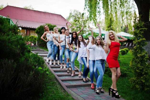 Girls having fun while posing outside in the park on the bachelorette party