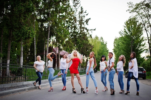 Girls having fun while posing outside in the park on the bachelorette party