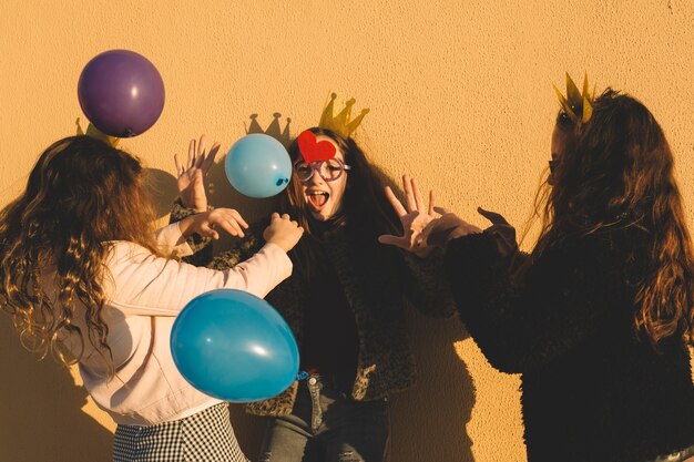 Girls having fun with balloons