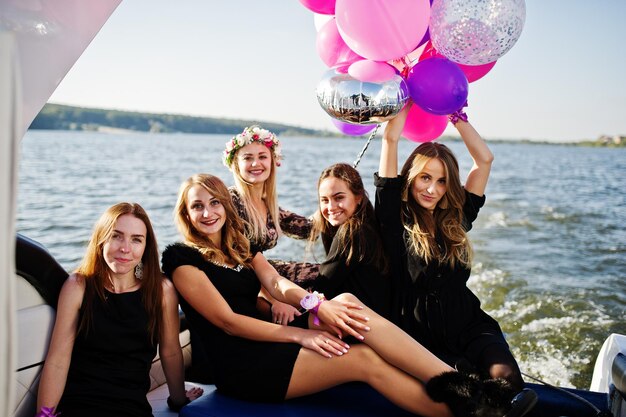 Girls having fun at yacht on hen party