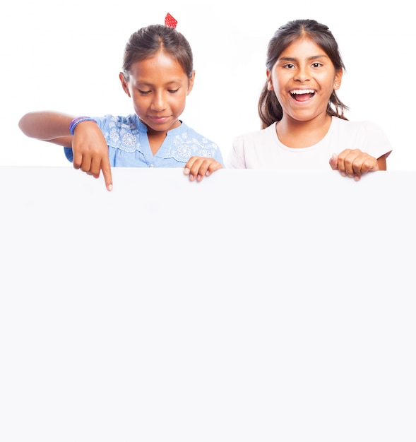 Girls holding a blank sign