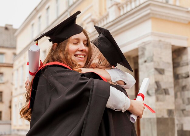 Girls hugging at graduation