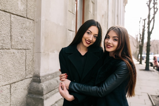 Girls hugging on the street