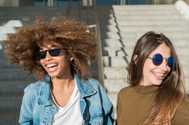 Girls laughing together outdoors