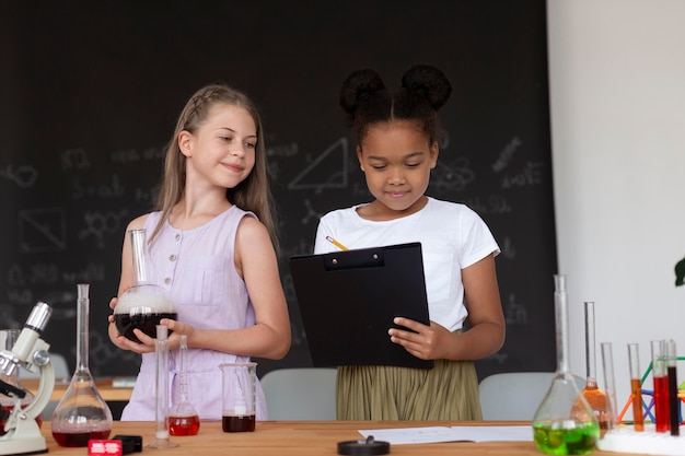 Girls learning more about chemistry in class