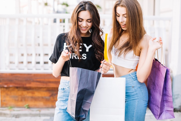 Girls looking into shopping bags