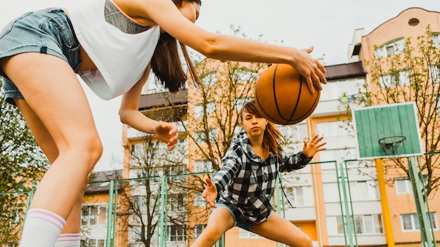 Free photo girls playing basketball