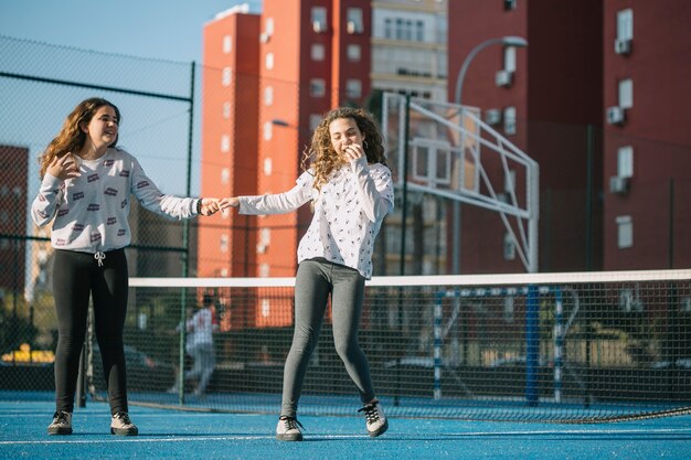 Free photo girls playing on rooftop