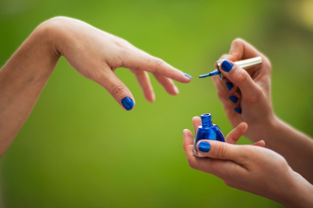 Girls polishing their nails