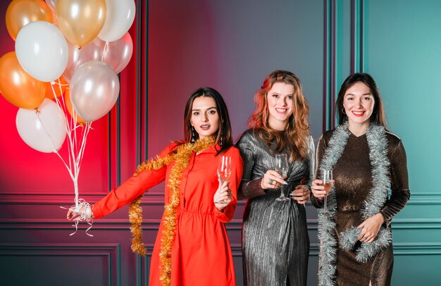 Girls posing with balloons