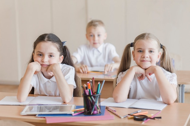 Girls sitting at desk in classroom