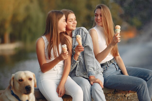 Girls sitting in a spring city with cute dog