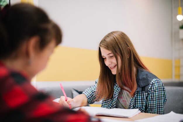 Girls smiling and studying